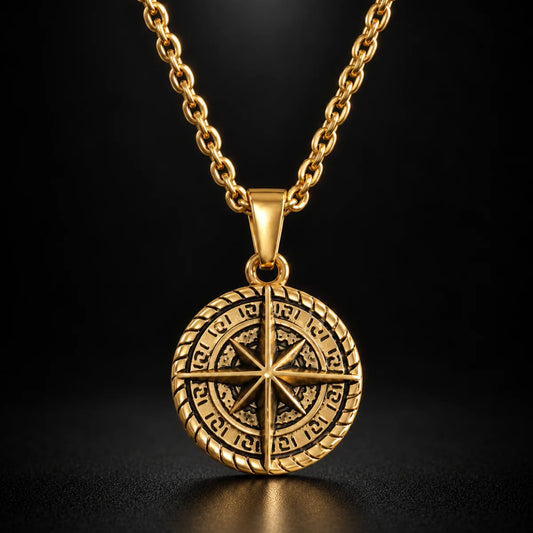 compass coin necklace gold black background hero