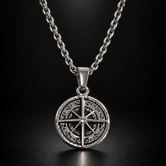 compass coin necklace silver black background hero