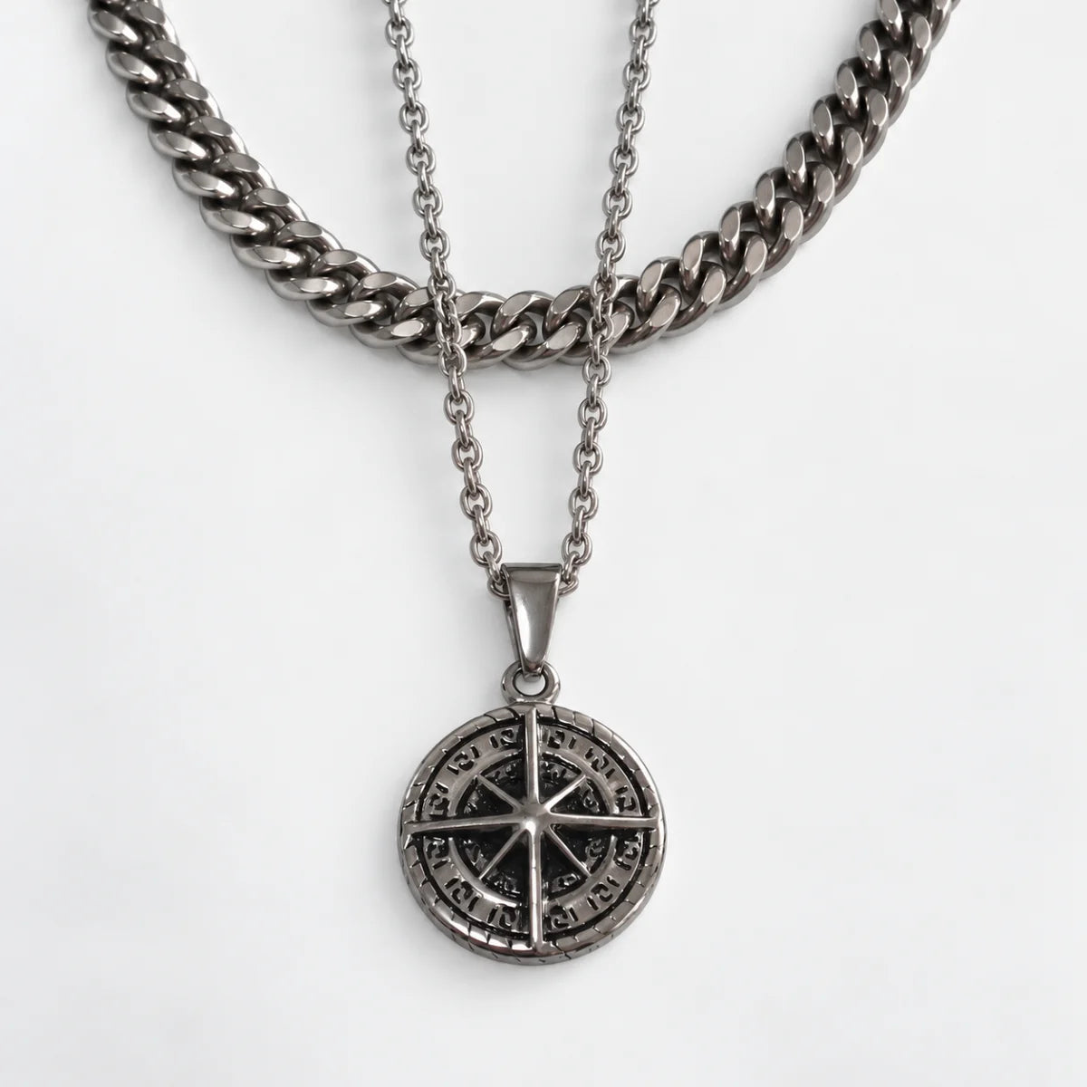 compass coin necklace silver layered set white background