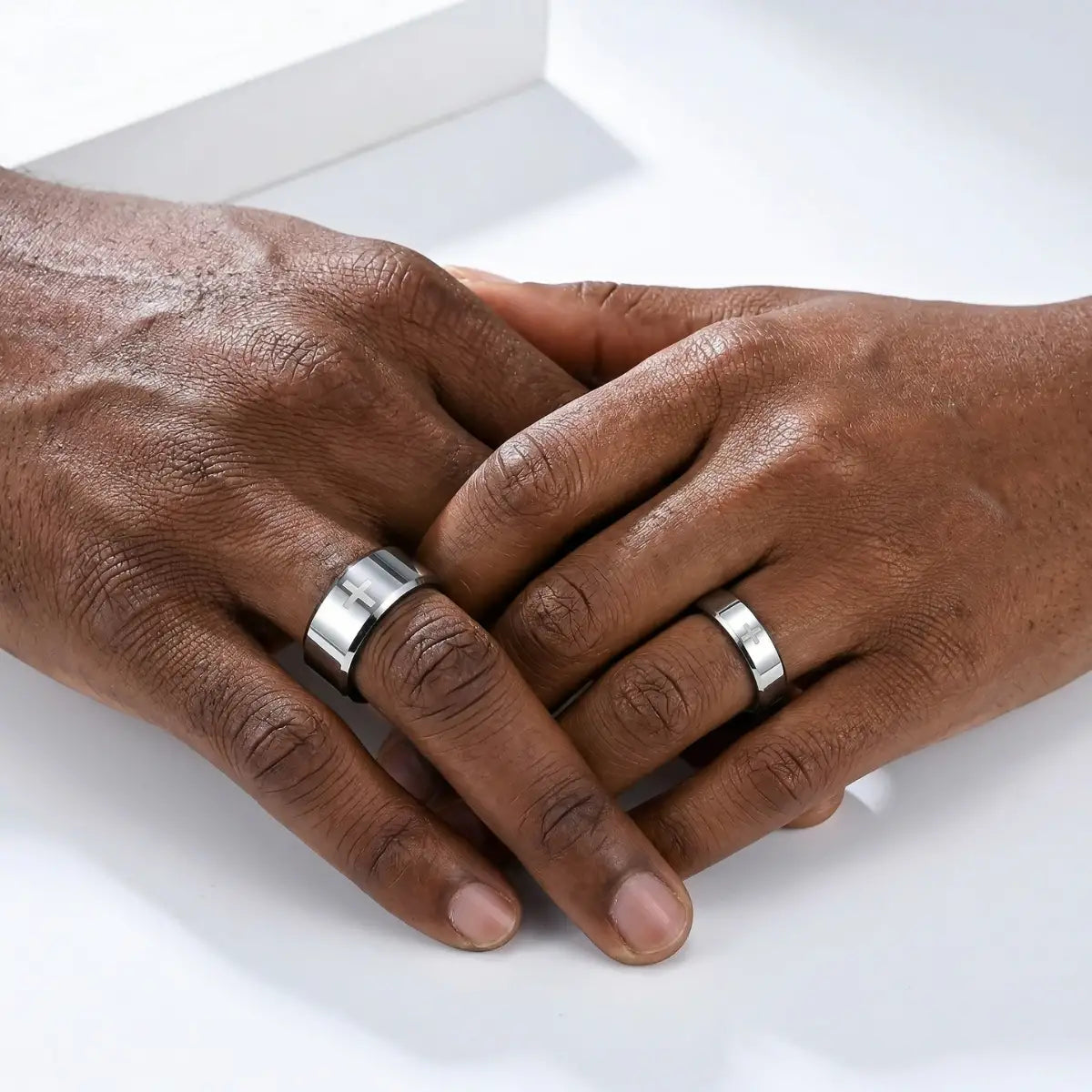 Couple wearing 6mm and 8mm silver Tungsten Cross Rings