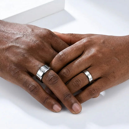 Couple wearing 6mm and 8mm silver Tungsten Cross Rings