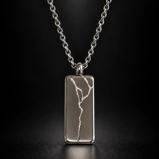 cracked bar necklace silver black background hero