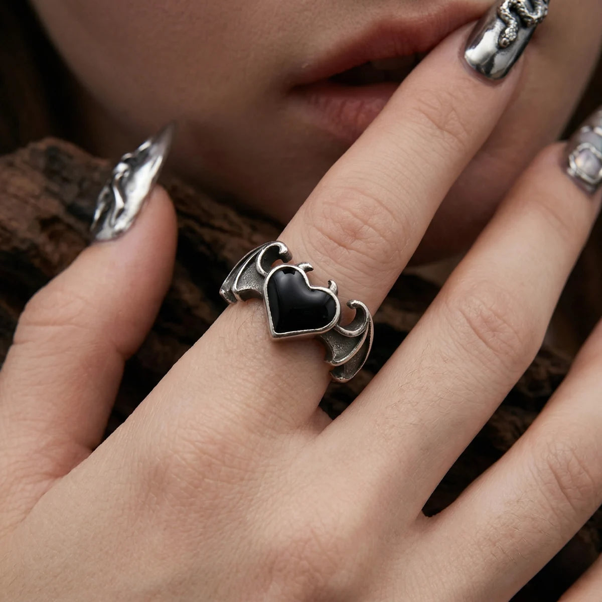 Female Hand Displaying Bat Wing Heart Ring Witchy Alternative Accessories