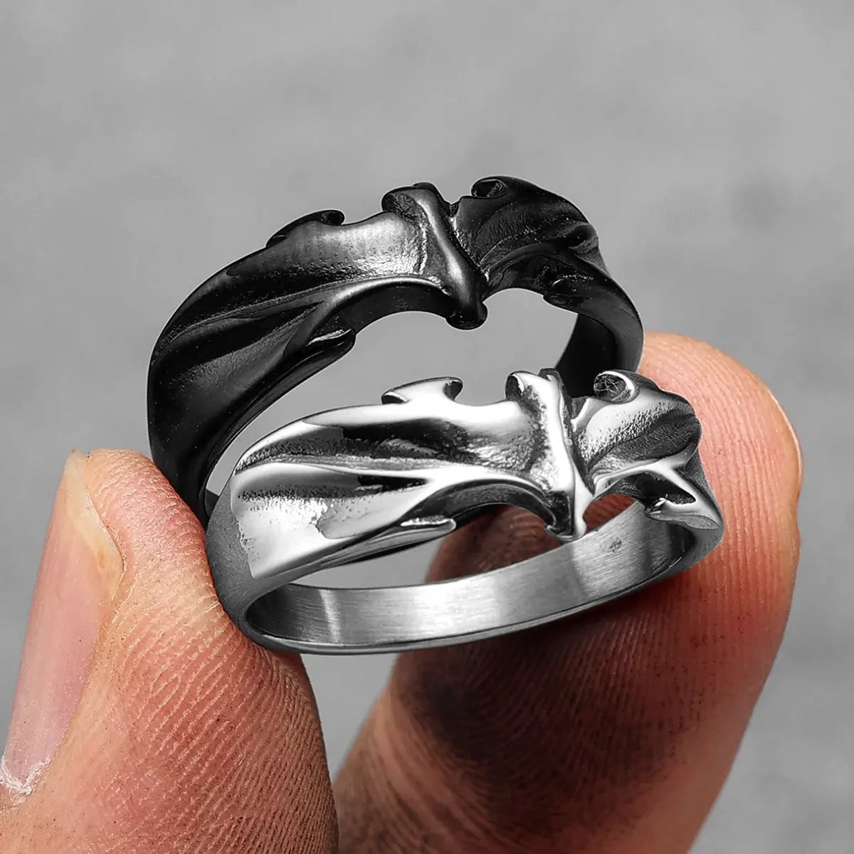 Fingers Holding Minimalist Bat Rings Collection Silver And Black Whimsigoth Accessories