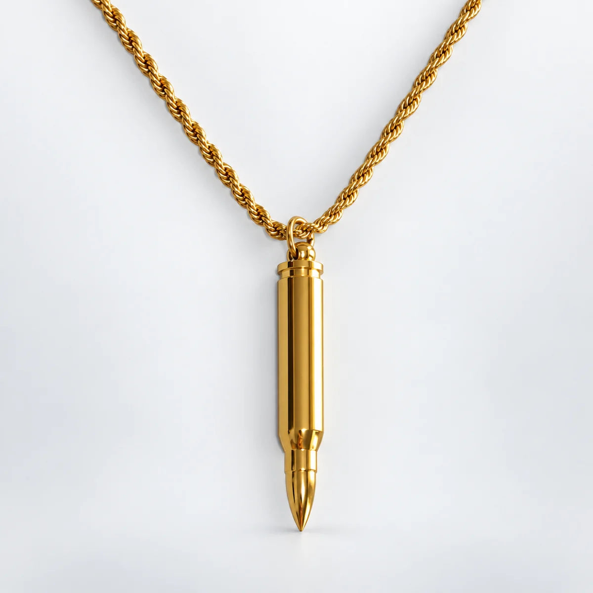 gold bullet capsule necklace with rope chain white background