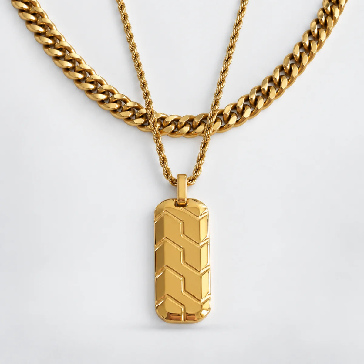 gold chevron dog tag necklace layered set white background