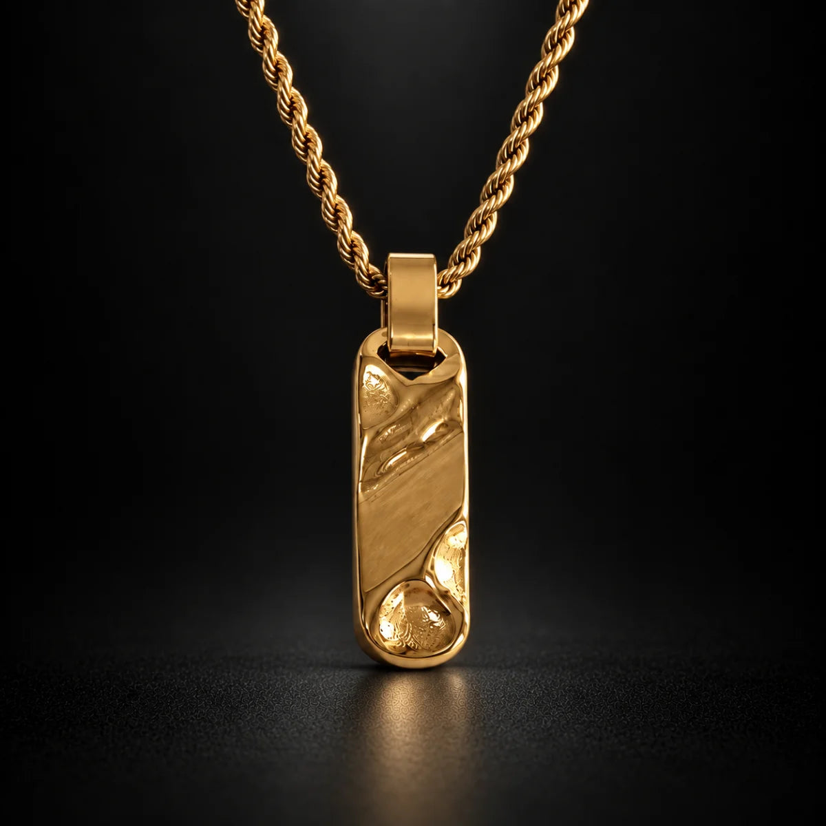 gold textured bar necklace black background hero