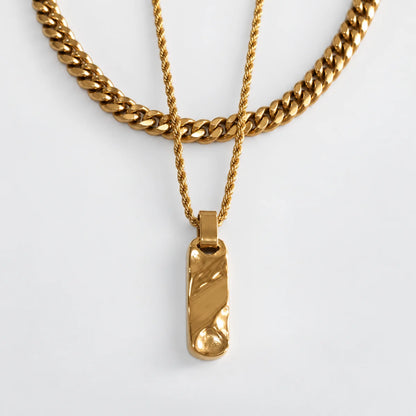gold textured bar necklace layered set white background