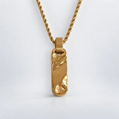 gold textured bar necklace with rope chain white background