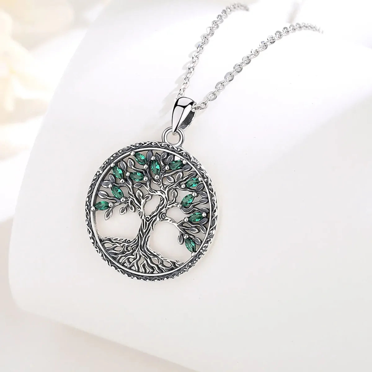 green crystal tree of life necklace jewelry display