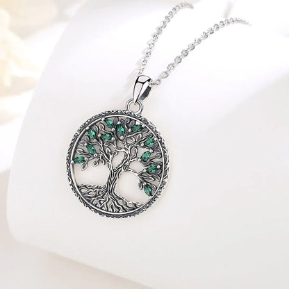 green crystal tree of life necklace jewelry display
