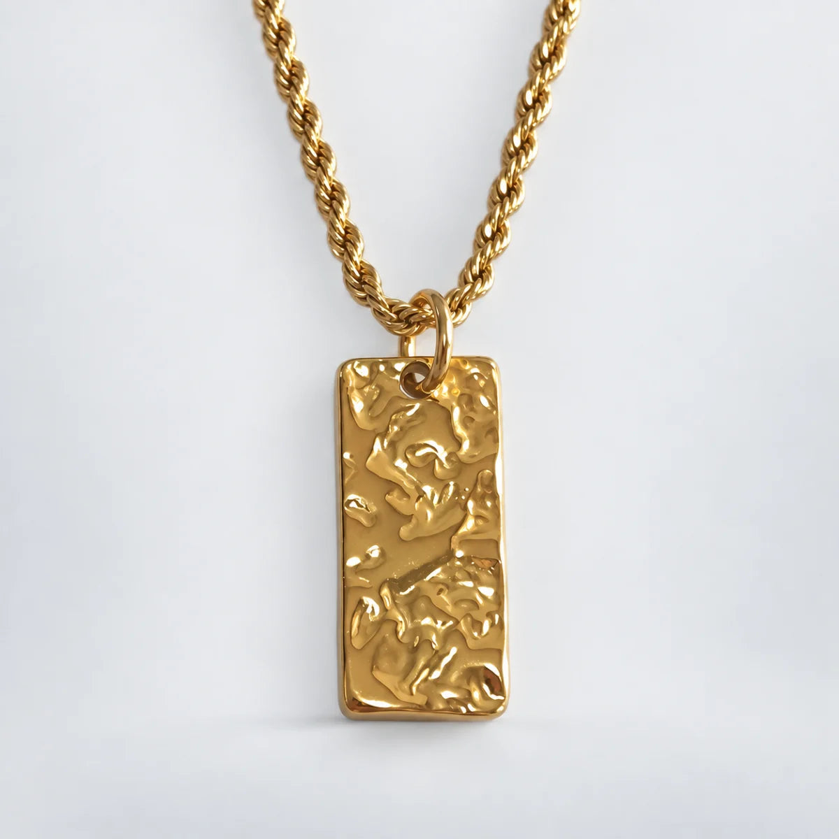 hammered rectangle necklace with rope chain white background