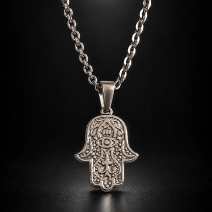 hamsa pendant necklace silver black background hero