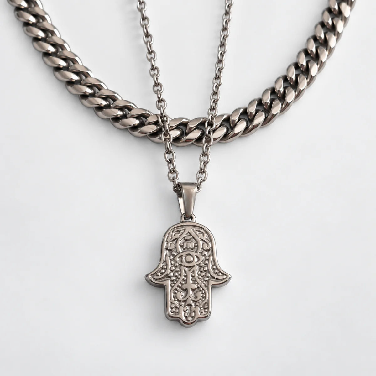 hamsa pendant necklace silver layered set white background