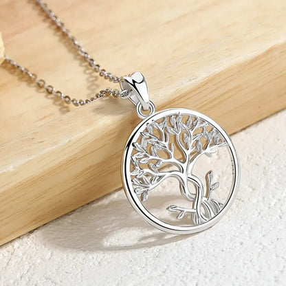 infinity tree of life necklace wood background jewelry display