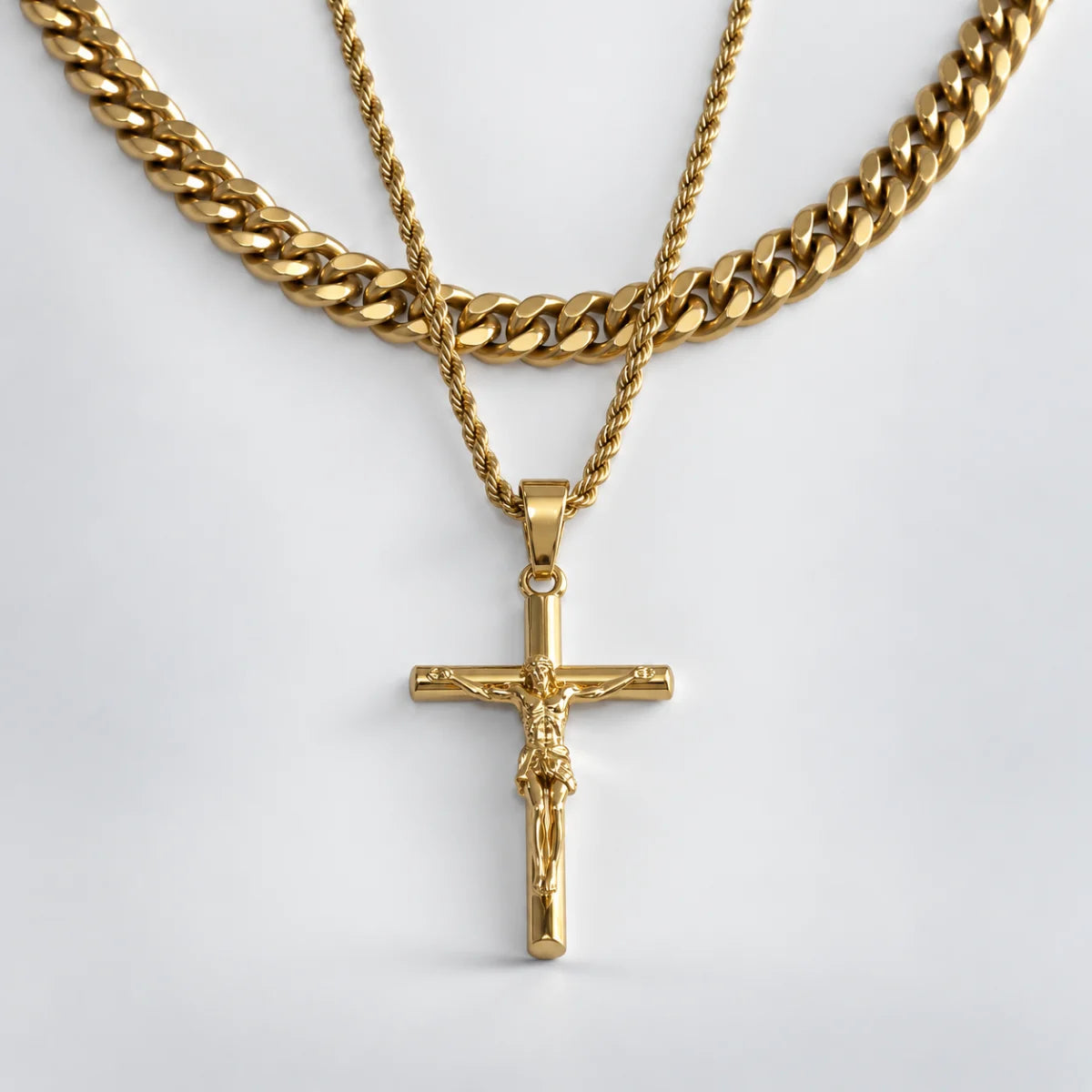 jesus crucifix rope chain gold layered set white background