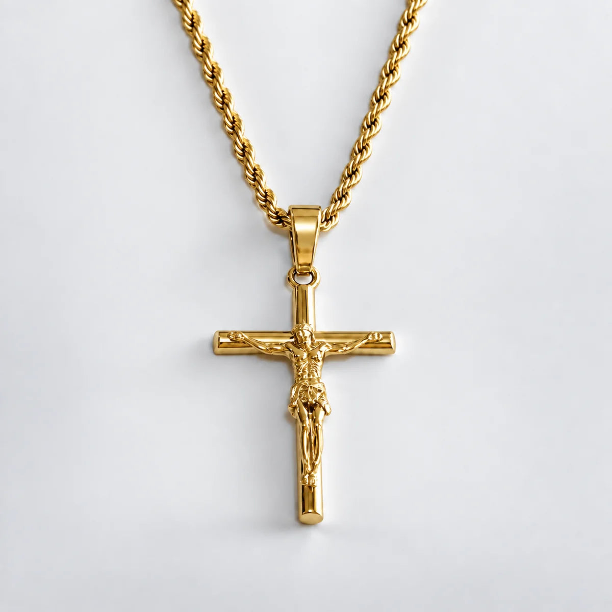jesus crucifix rope chain gold white background