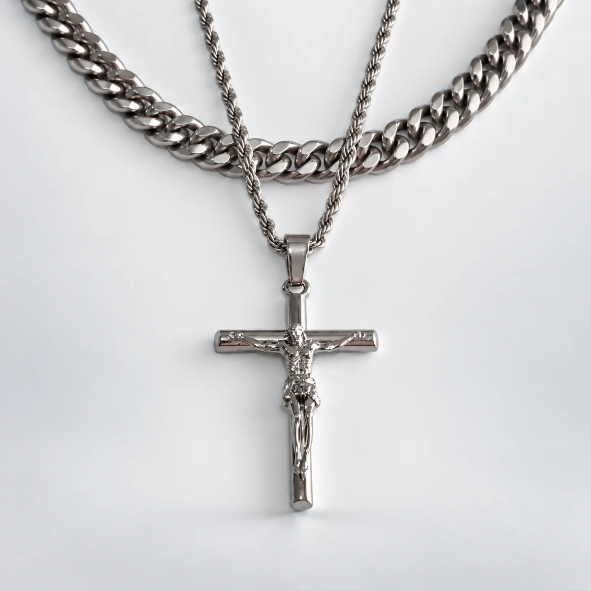 jesus crucifix rope chain silver layered set white background