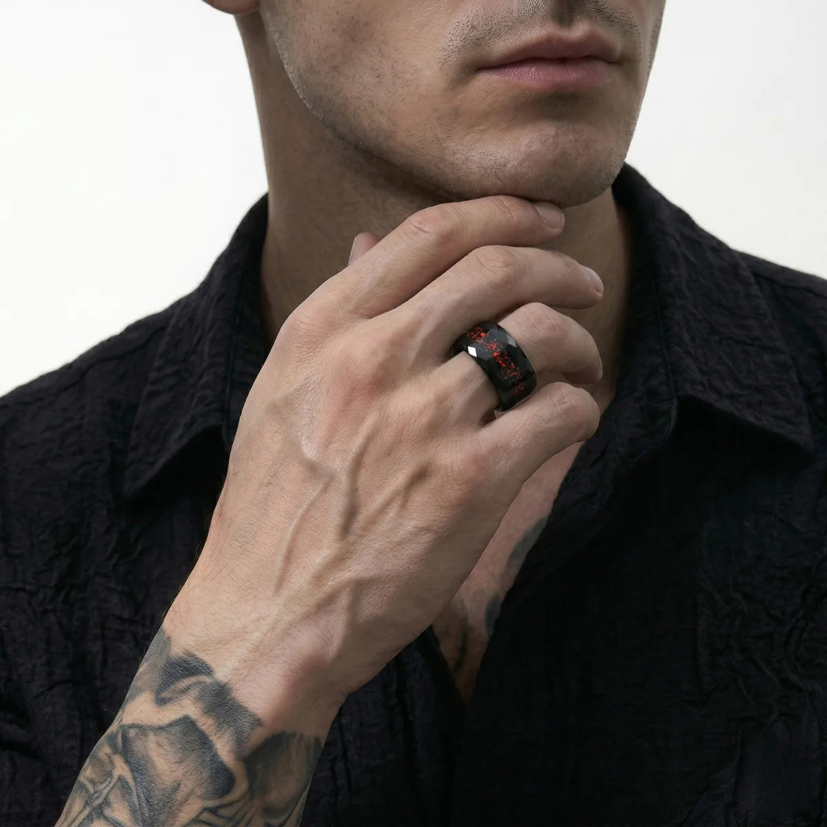 Lifestyle shot of man wearing 8mm Black Hammered Opal Tungsten Ring