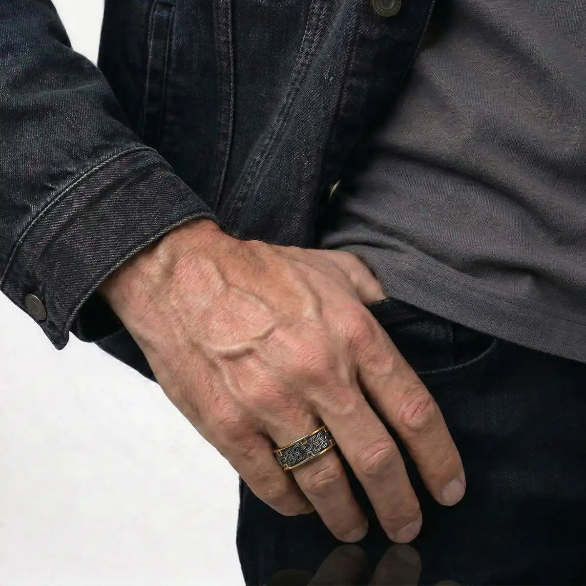 Lifestyle shot of man wearing gold Greek Key Ring