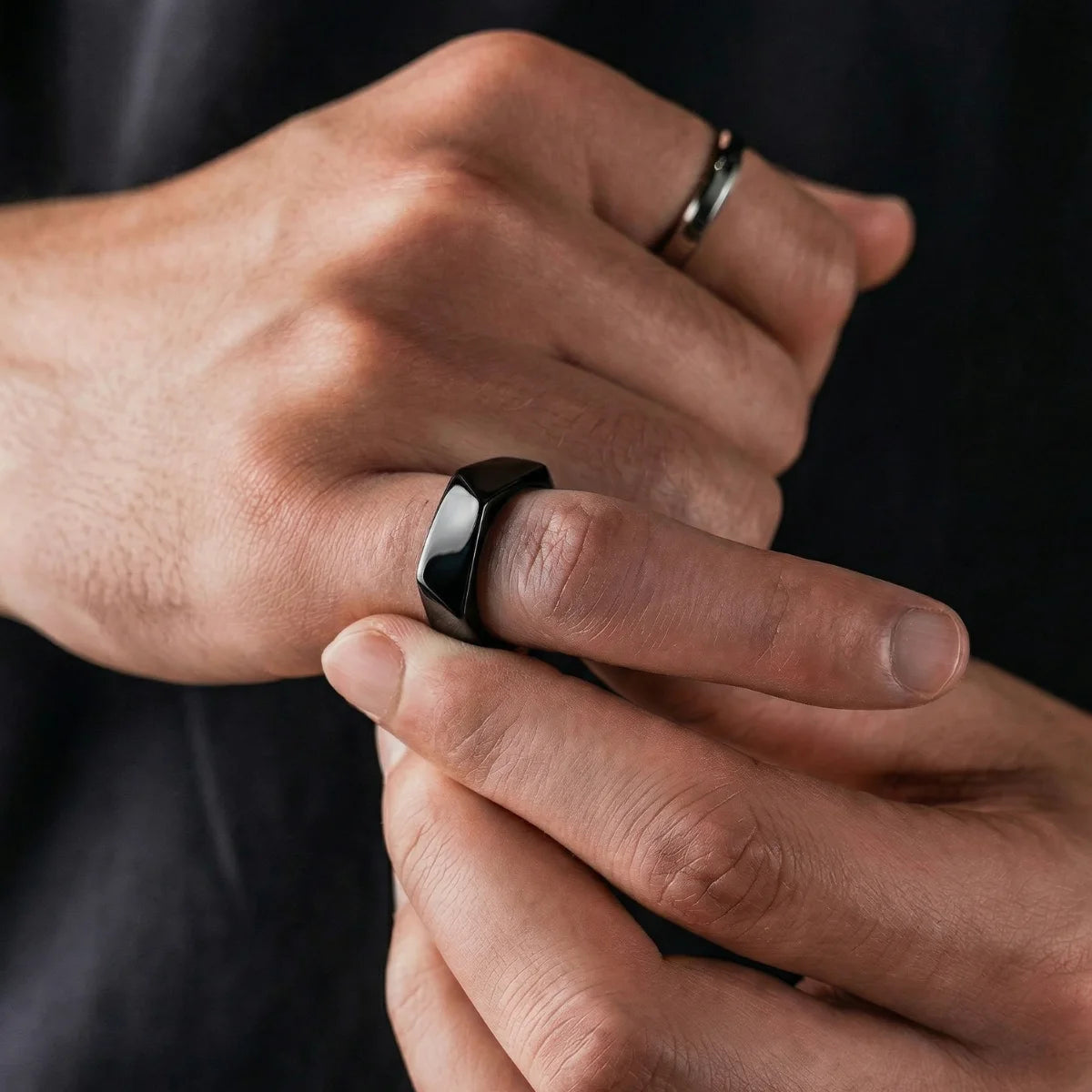 Lifestyle shot of man wearing black Pentagon Ring