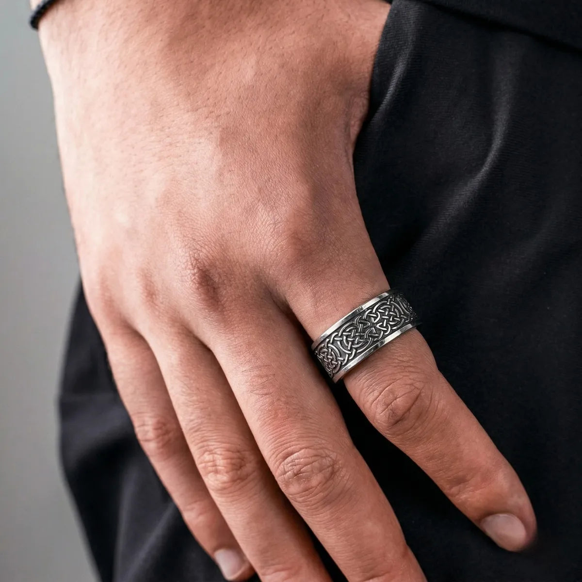 Lifestyle shot of man wearing black Celtic Knot Band