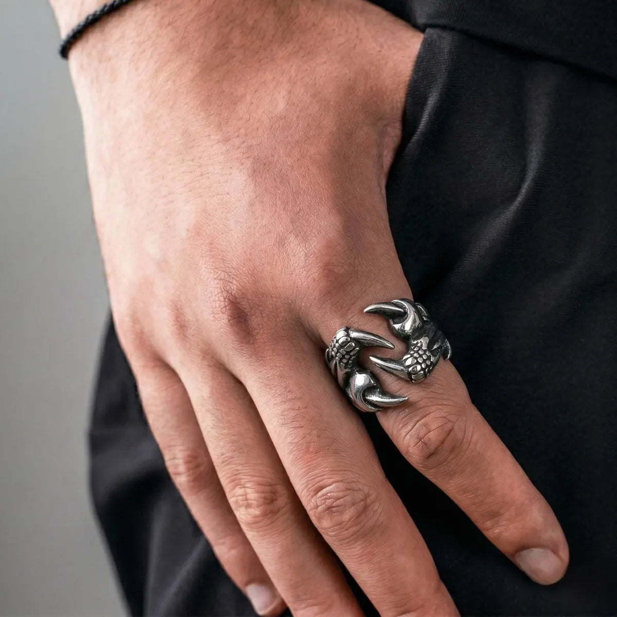 Lifestyle shot of man wearing silver Dragon Claw Ring
