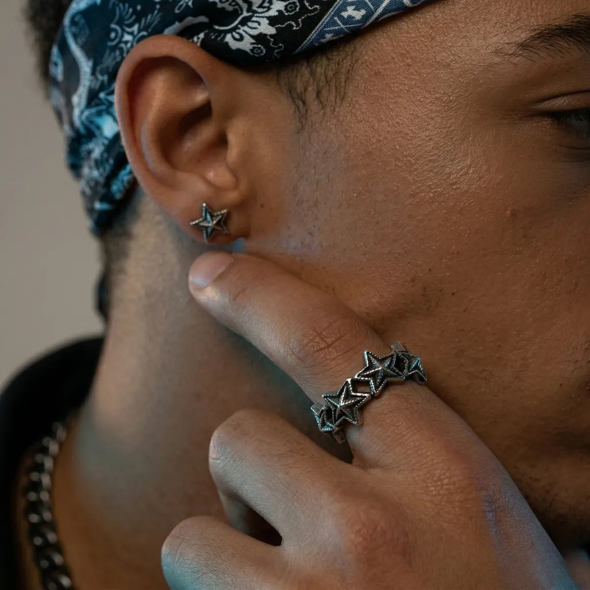 Lifestyle shot of man wearing silver Punk Star Ring