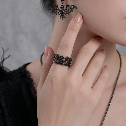 Lifestyle shot of woman wearing black Red Stone Crown Ring