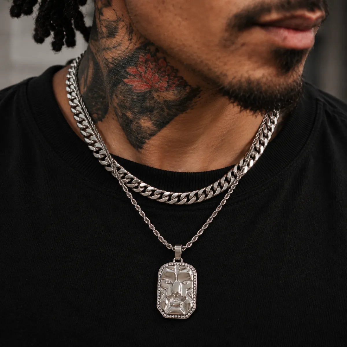lion head dog tag necklace layered set lifestyle tattooed model