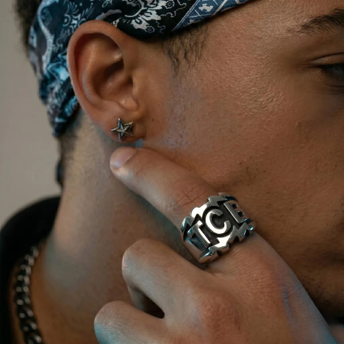 Man Wearing TCB Ring Silver Heavy Biker Statement Jewelry