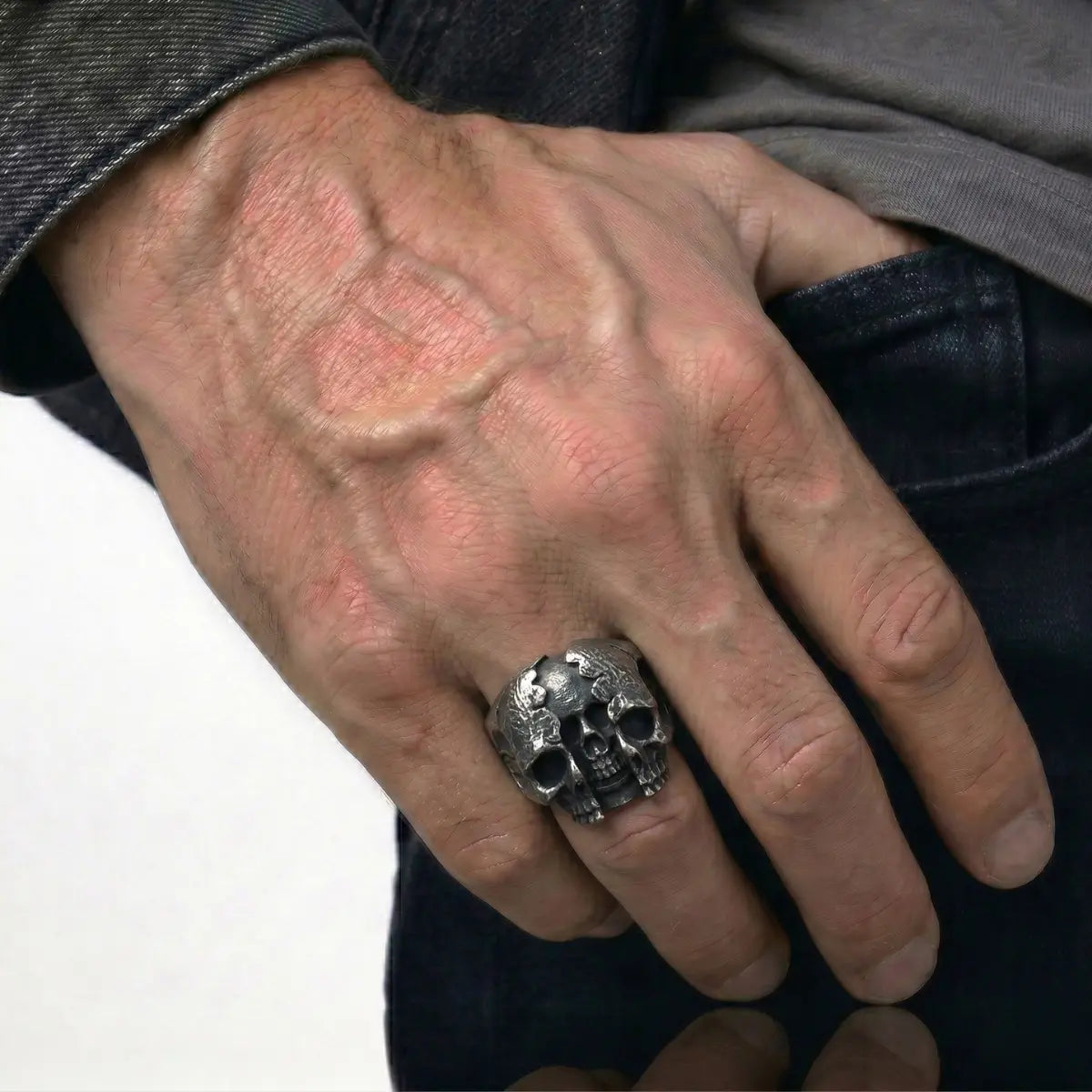 Man Wearing Three Headed Skull Ring Hand Model Biker Jewelry