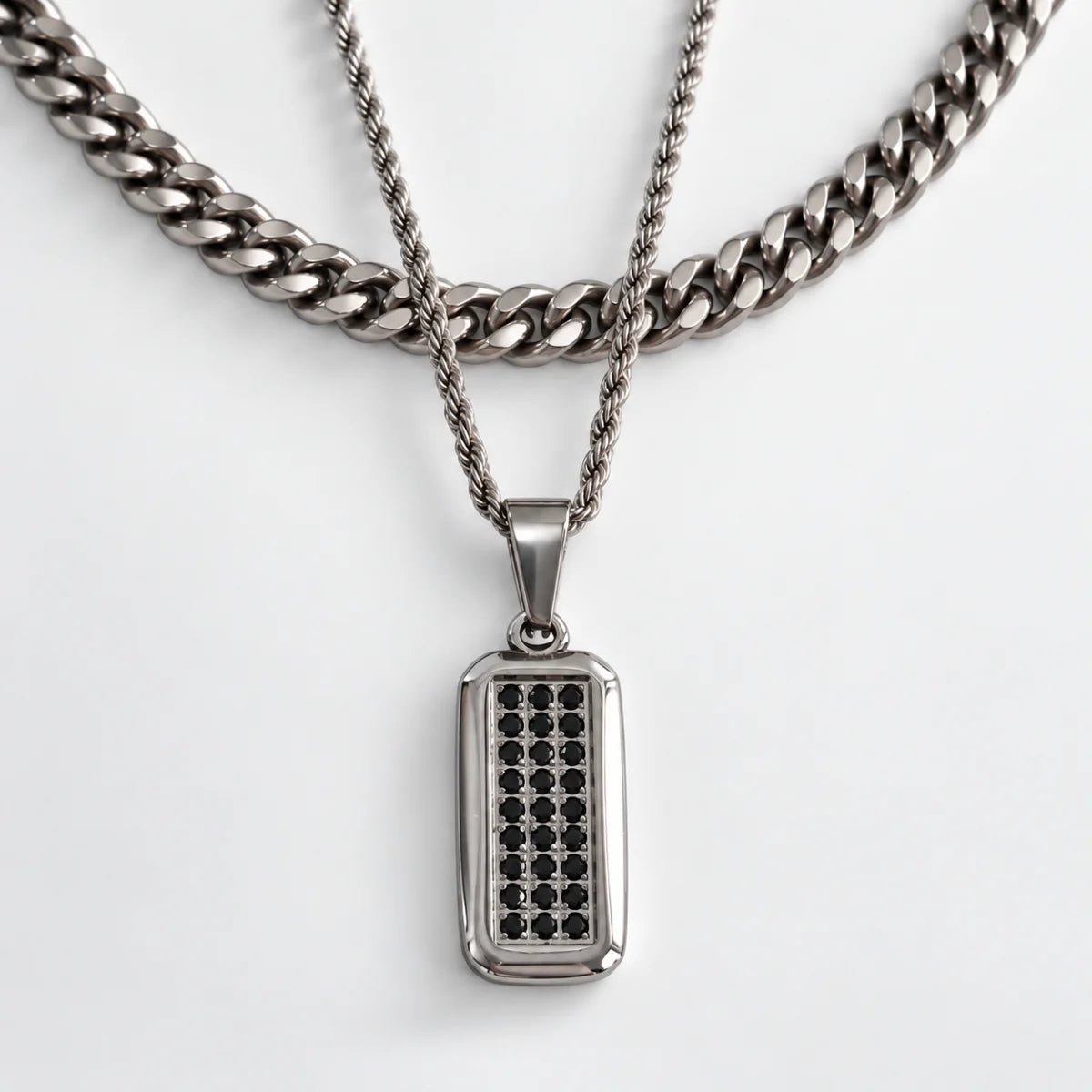 men‘s black cz dog tag necklace layered set white background