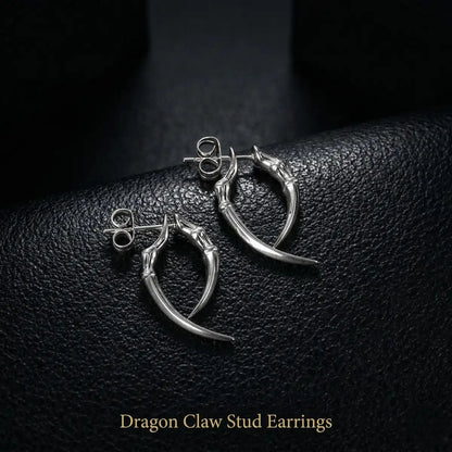 Men‘s silver Dragon Claw Stud Earrings on dark texture