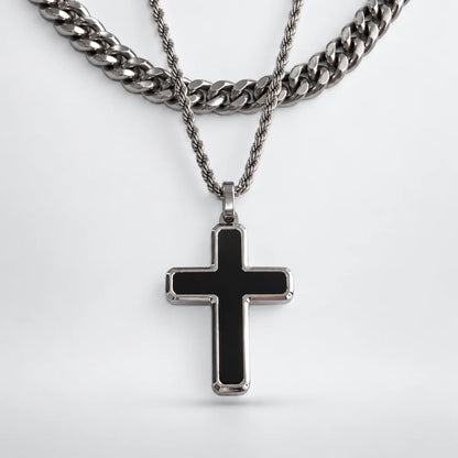 minimalist black cross necklace layered set white background