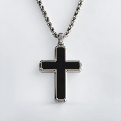 minimalist black cross necklace with rope chain white background