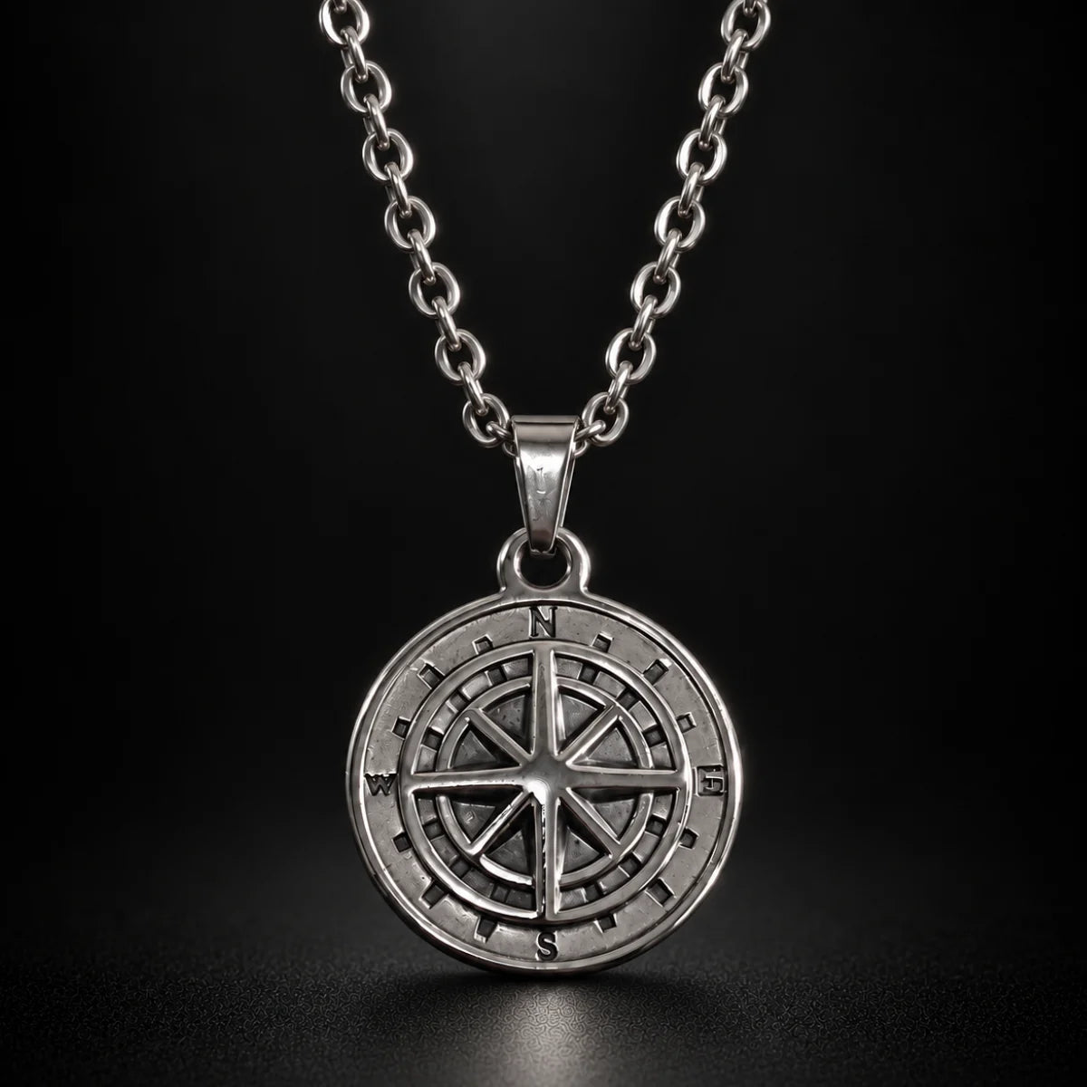 minimalist compass pendant necklace silver black background hero