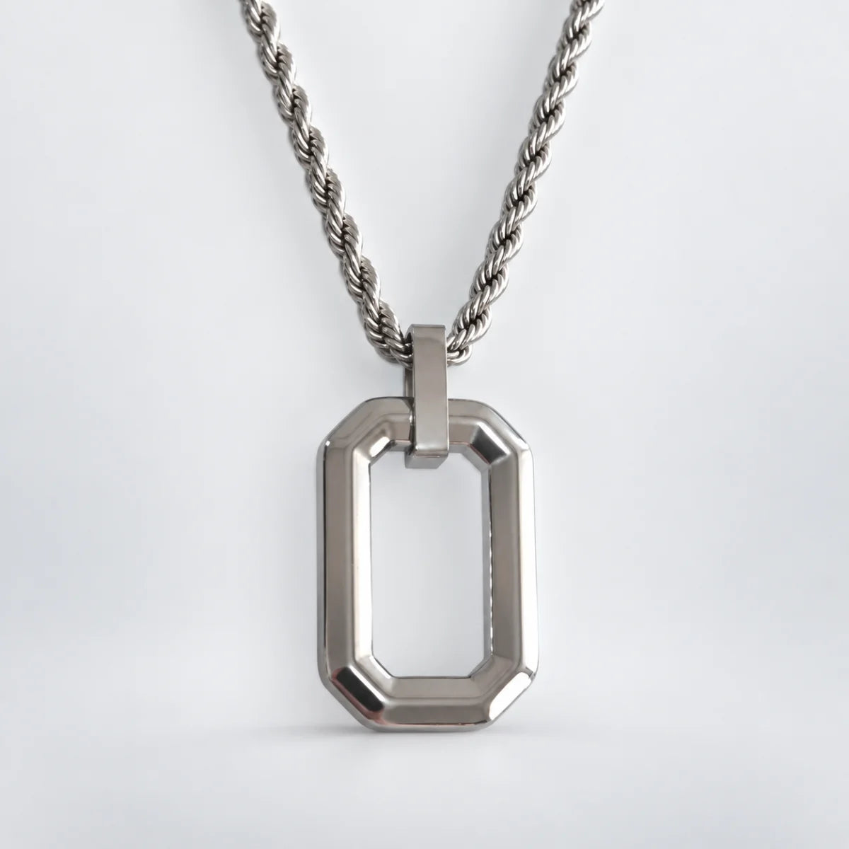 open rectangle necklace with rope chain white background