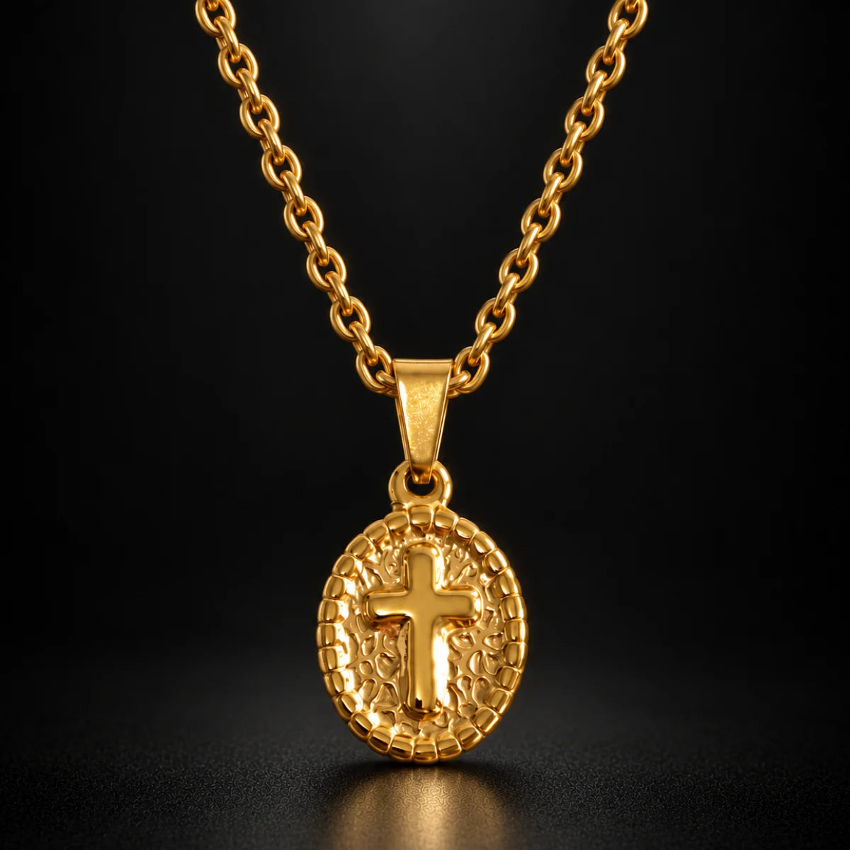 oval cross pendant necklace gold black background hero