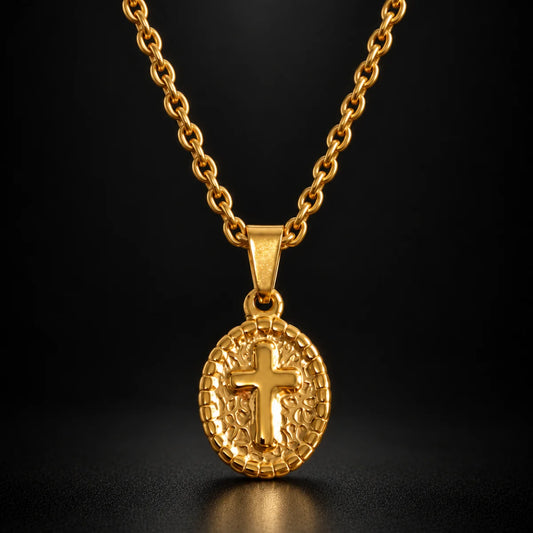 oval cross pendant necklace gold black background hero