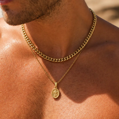 oval cross pendant necklace gold layered set lifestyle bare chest