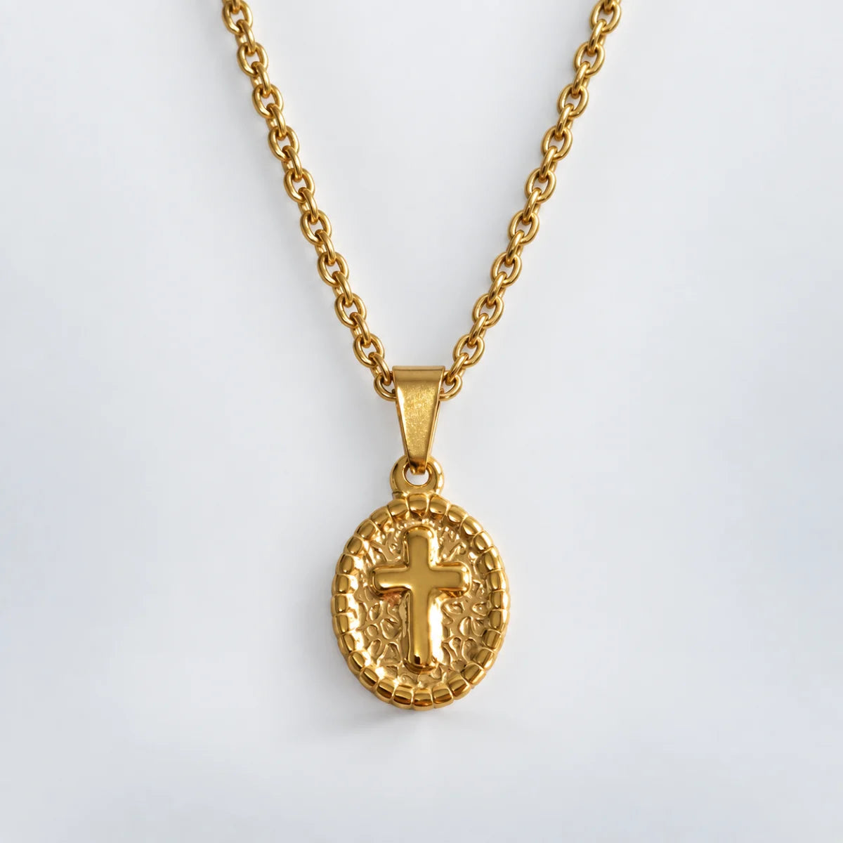 oval cross pendant necklace gold with o chain white background