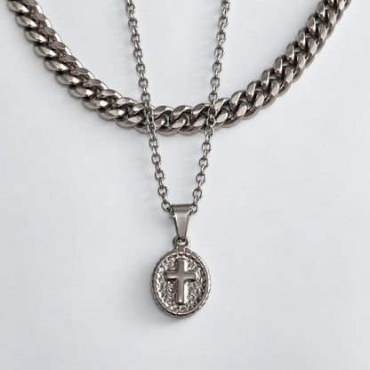 1. oval cross pendant necklace silver layered set white background