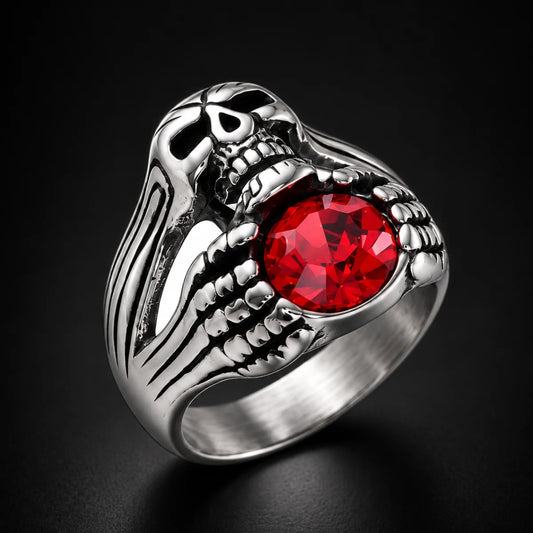 Red Gemstone Skeleton Hand Ring Black Background