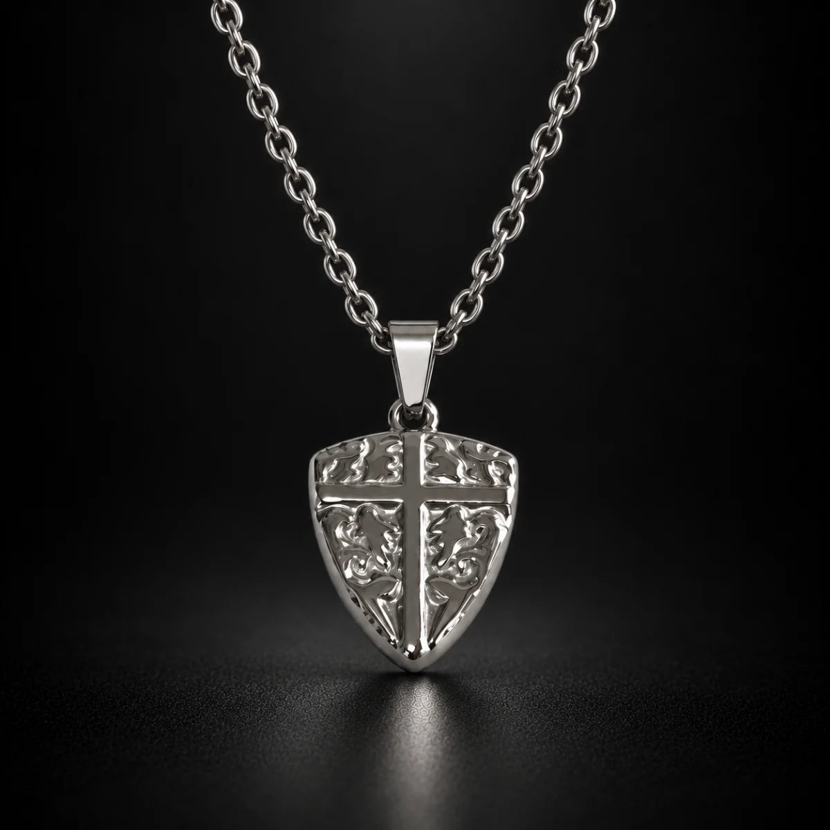 shield cross pendant necklace silver black background hero
