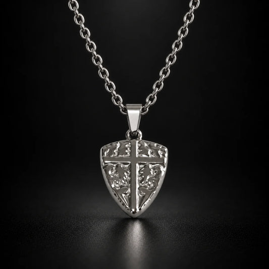 shield cross pendant necklace silver black background hero