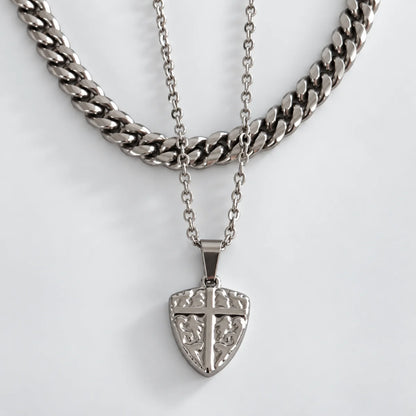 shield cross pendant necklace silver layered set white background