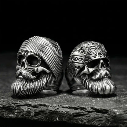 Silver Beard Skull Rings Style A and B on dark stone