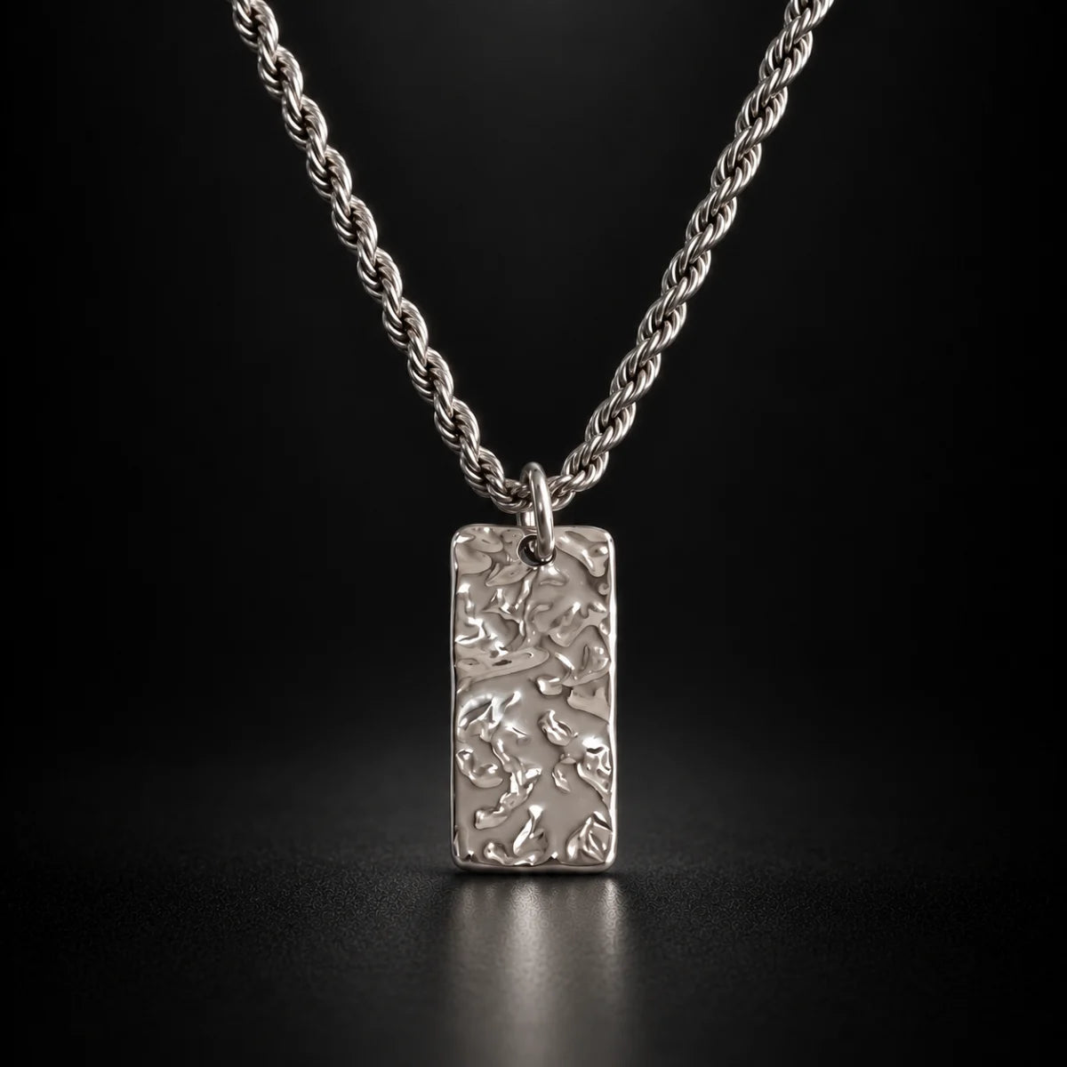 silver hammered rectangle necklace black background hero