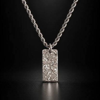 silver hammered rectangle necklace black background hero